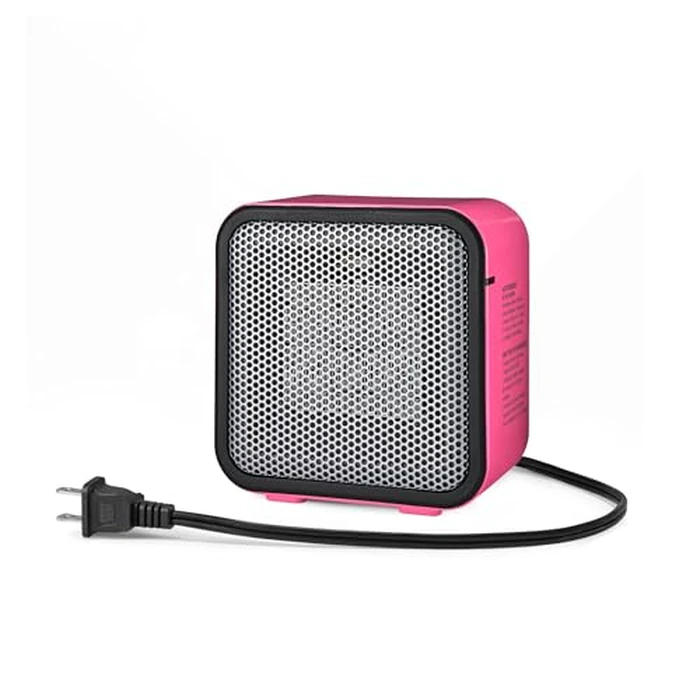 Amazon Basics Ceramic Space Heater, Mini Heater for Office Desk, Portable Tent Heater (Indoor Use), 500 W, With Tip-Over Protection, Lightweight (1.4 LBS), Pink, 5.87 x 3.15 x 5.95 inches by Amazon Basics - Used - Like New condition - CA$24.96