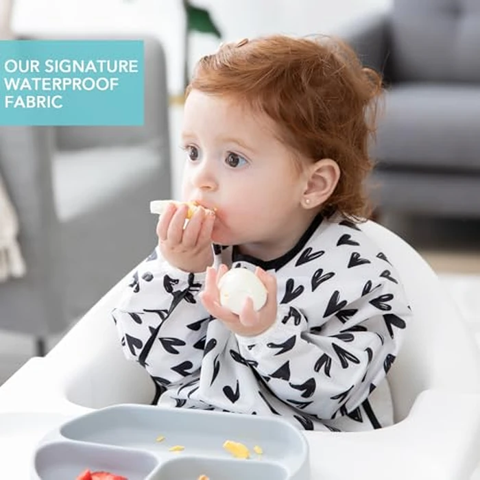 Bumkins Sleeved Bib for Girl or Boy, Baby and Toddler for 6-24 Months, Essential Must Have for Eating, Feeding, Baby Led Weaning Supplies, Long Sleeve Mess Saving Food Catcher, Hearts Black and White by Bumkins - Image 3