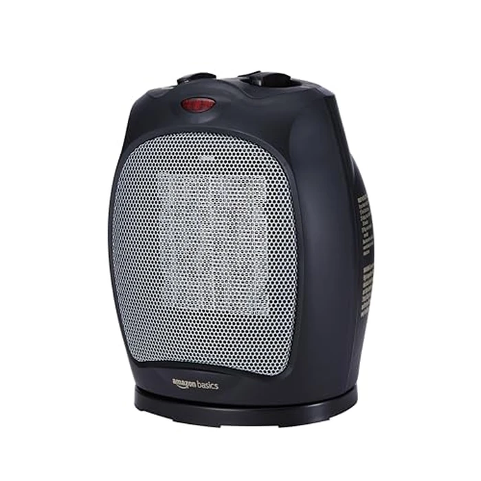 Amazon Basics Oscillating Ceramic Space Heater, Portable Heater for Indoor Use, for Office and Home, With Overheat and Tip-Over Protection, Thermostat, 1500W, Black, 7.52"D x 6.34"W x 9.45"H by Amazon Basics - Used - Acceptable condition - CA$21.95